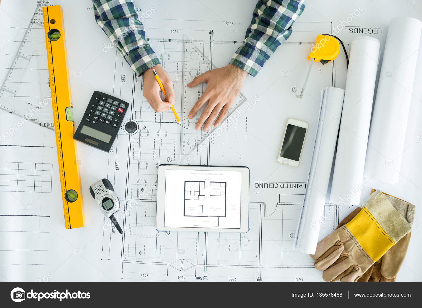 depositphotos 135578468 stock photo architect drawing blueprint