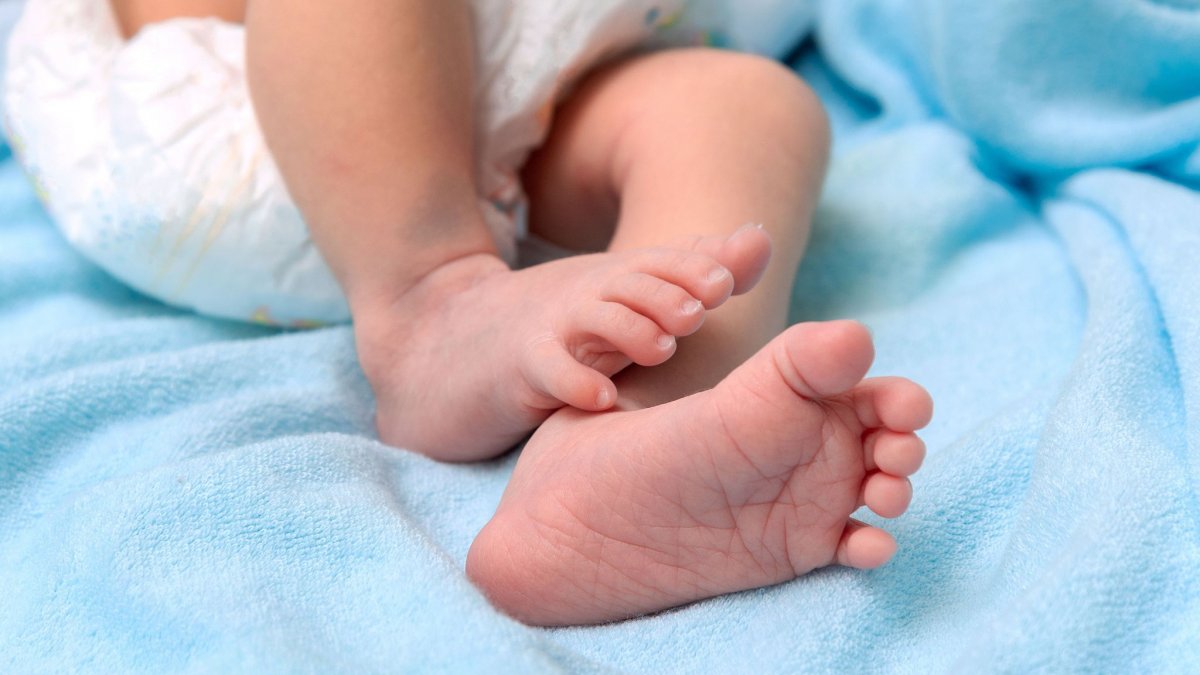 05944020 bigstock New Born Baby Feet On White Bl 449030203
